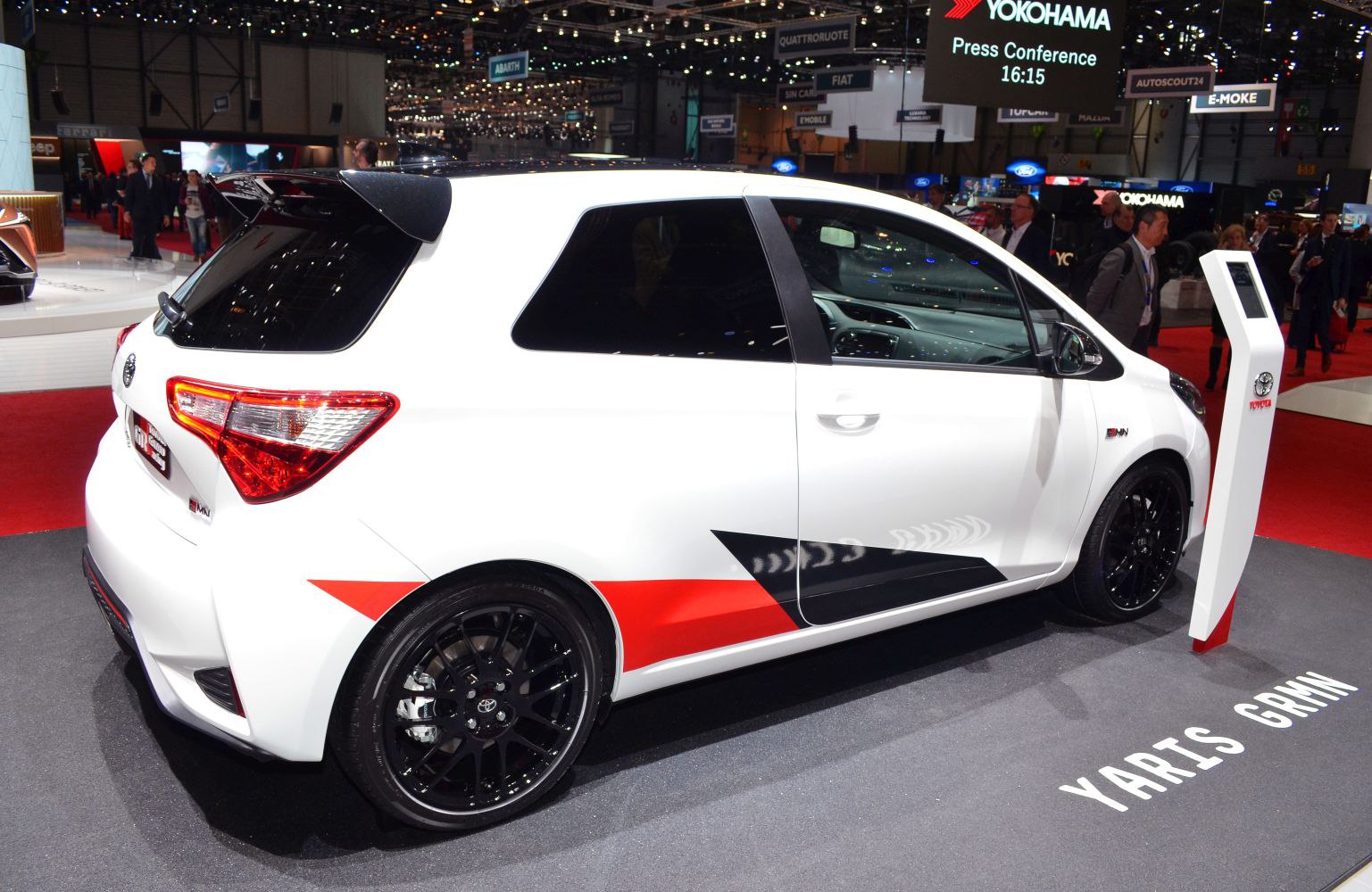 White compact hatchback with rear spoiler and black alloy wheels