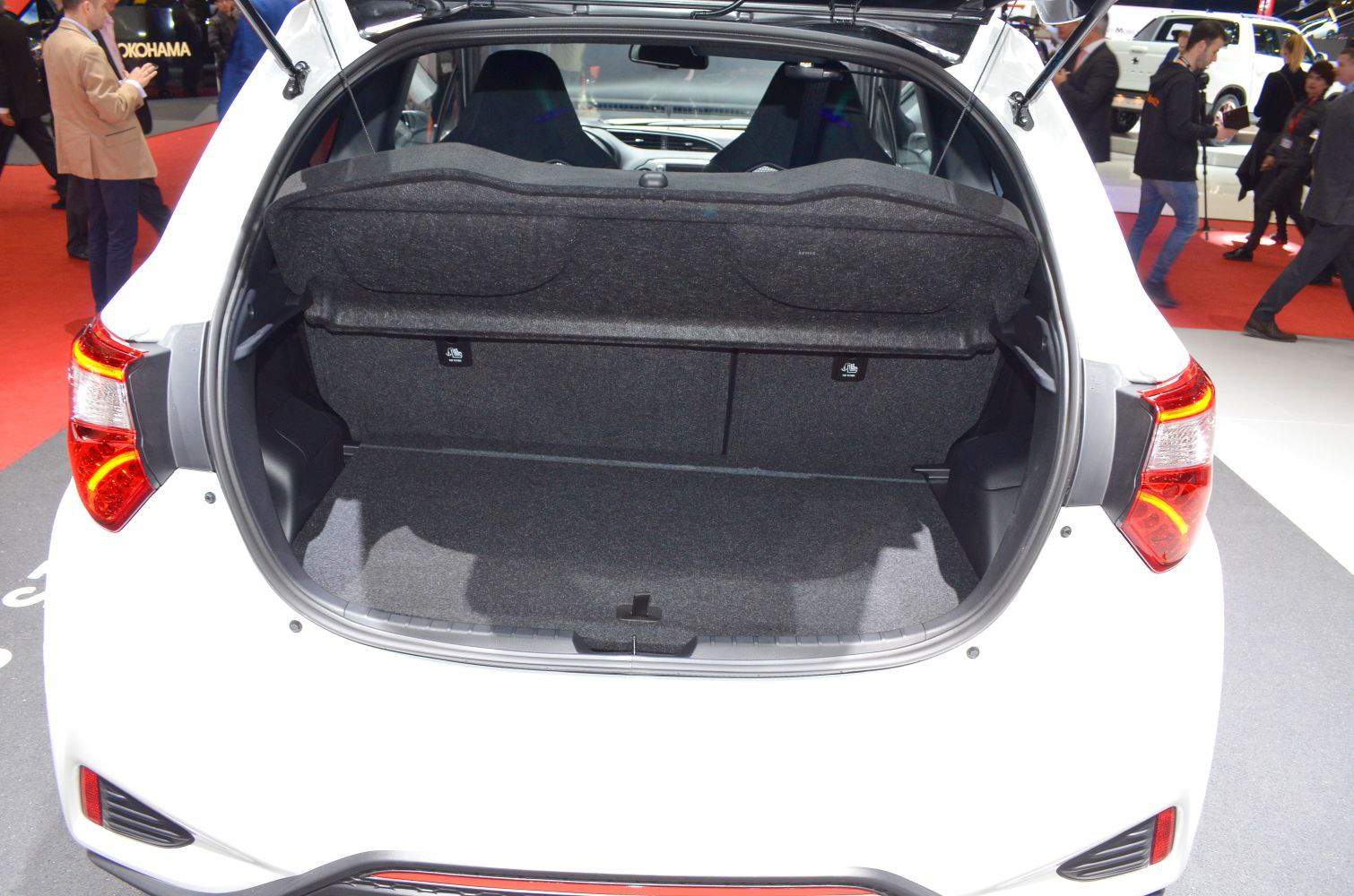 Open rear cargo space of compact hatchback with black interior liner