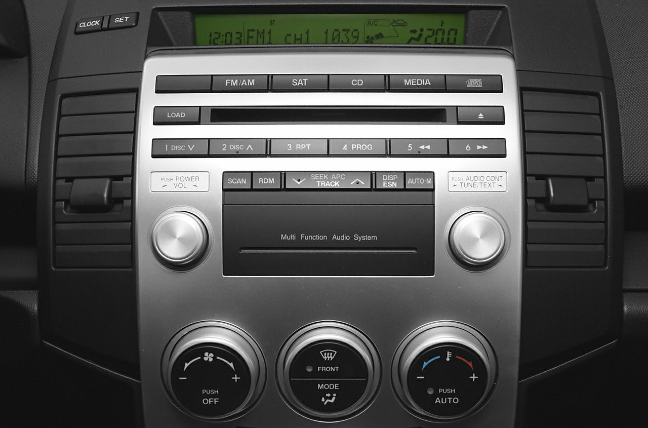 Dashboard audio system and climate controls with knobs and buttons
