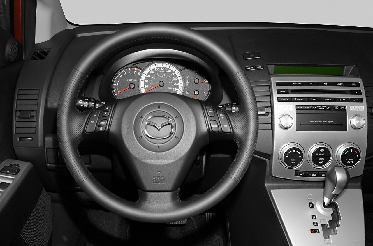Dashboard, steering wheel, and gear lever in car interior