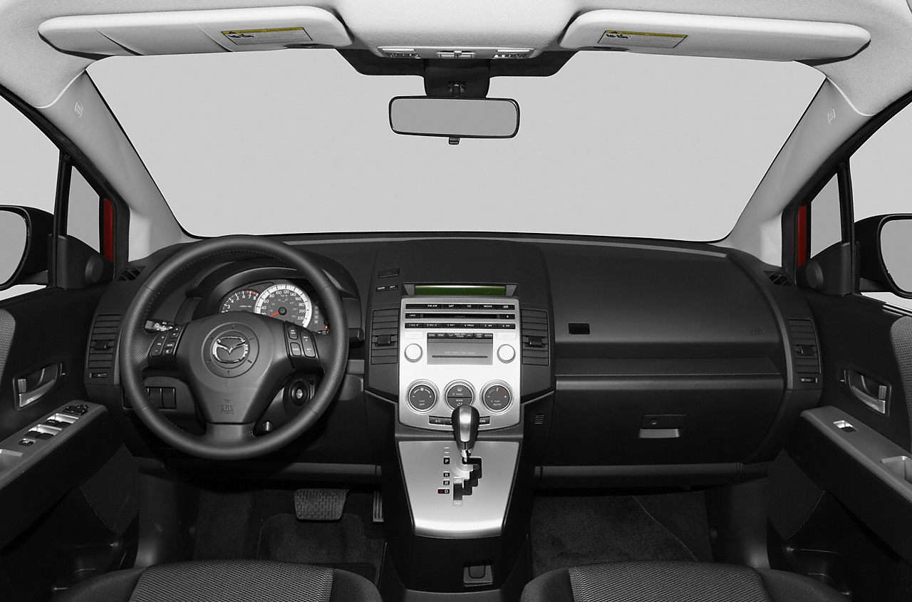 Dashboard layout with multifunction steering wheel and central control panel