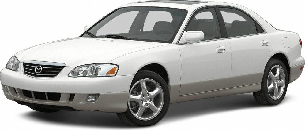 Front side view of a white sedan with alloy wheels and distinctive headlights