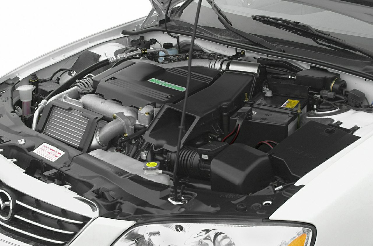 Close-up of engine bay with turbocharger and mechanical components