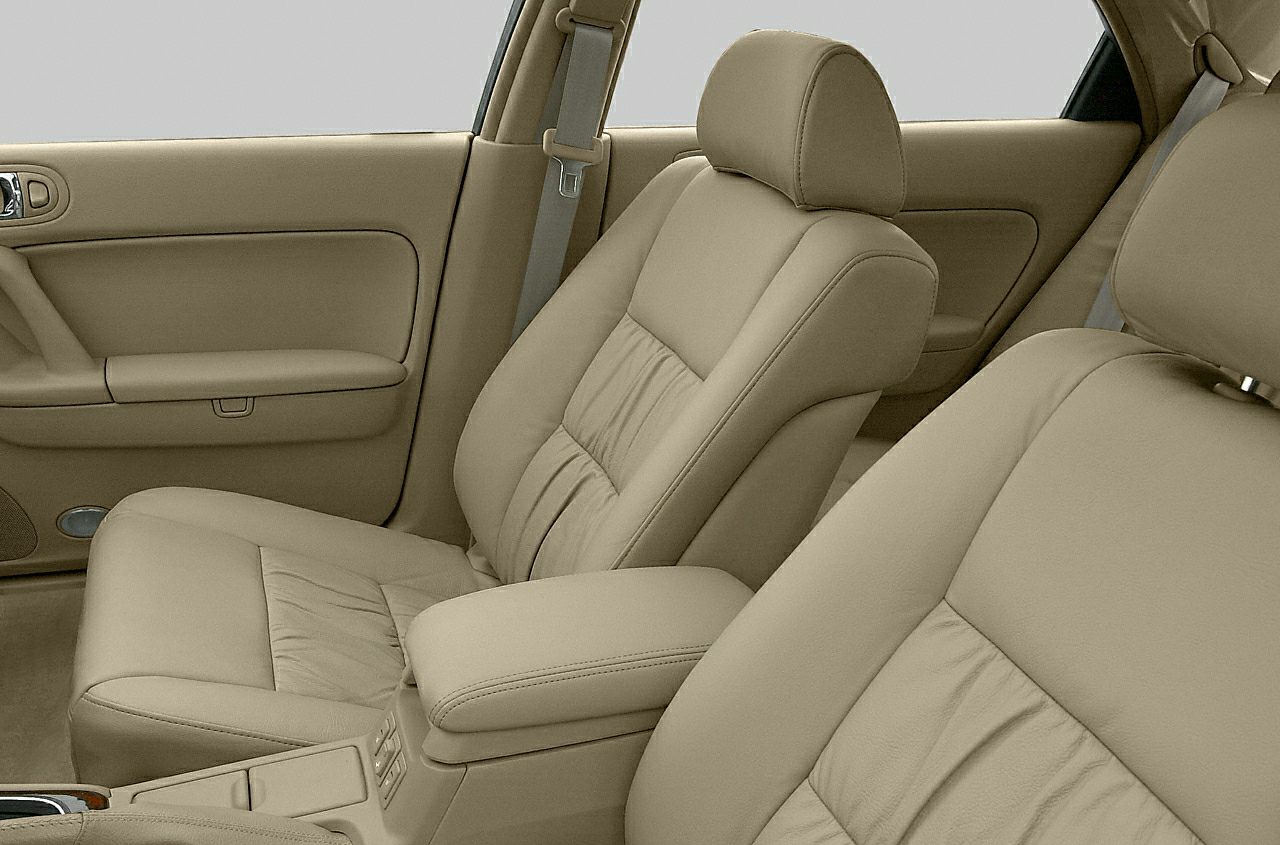 Beige leather front seats and interior door panel