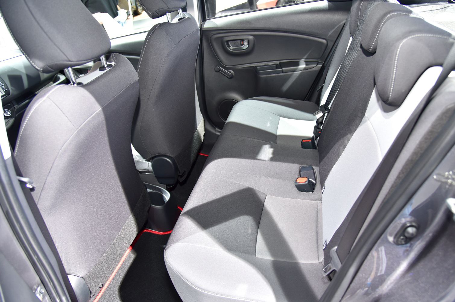 Rear seat interior with fabric upholstery and compact design