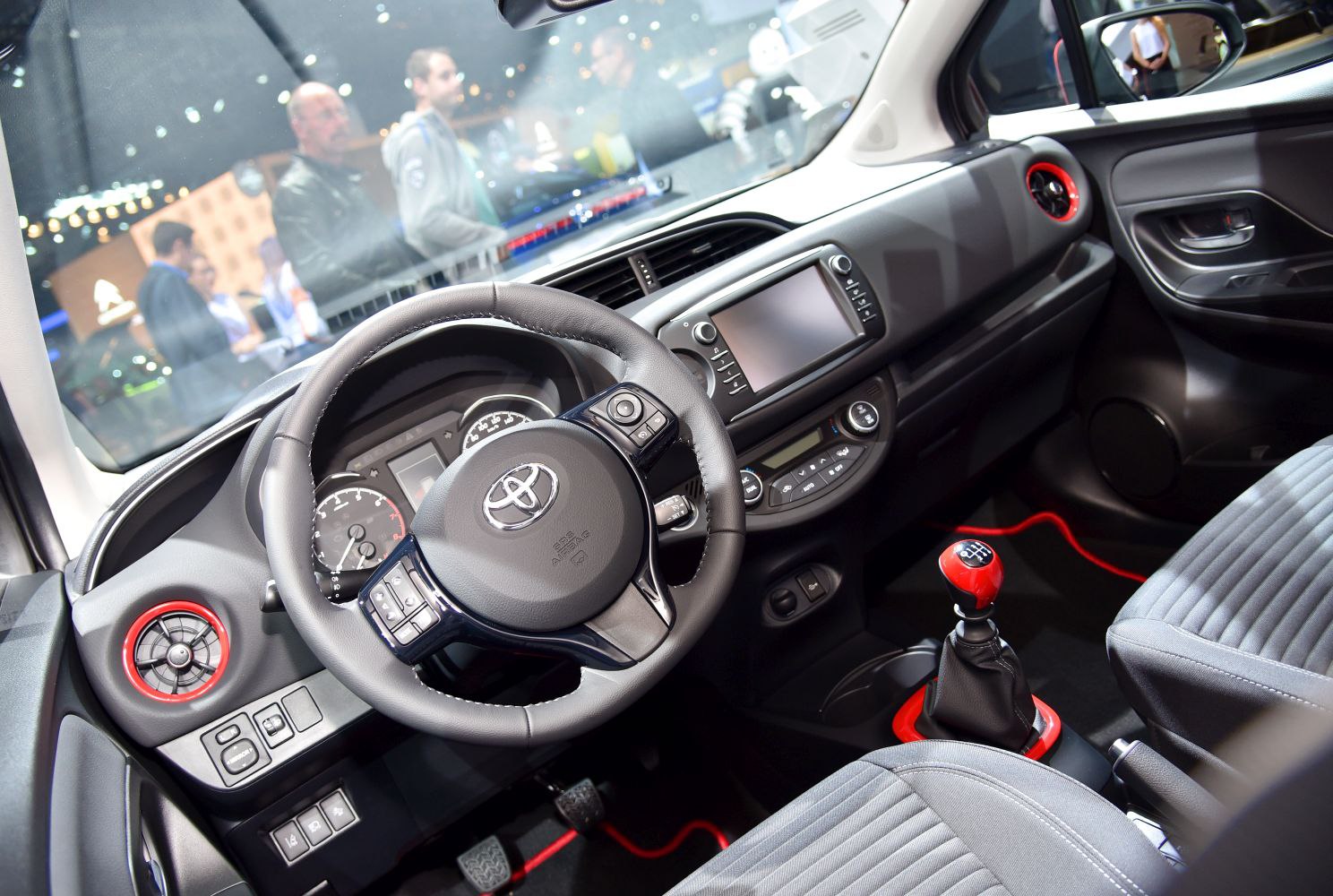 Modern dashboard, manual gear shift, steering wheel with controls