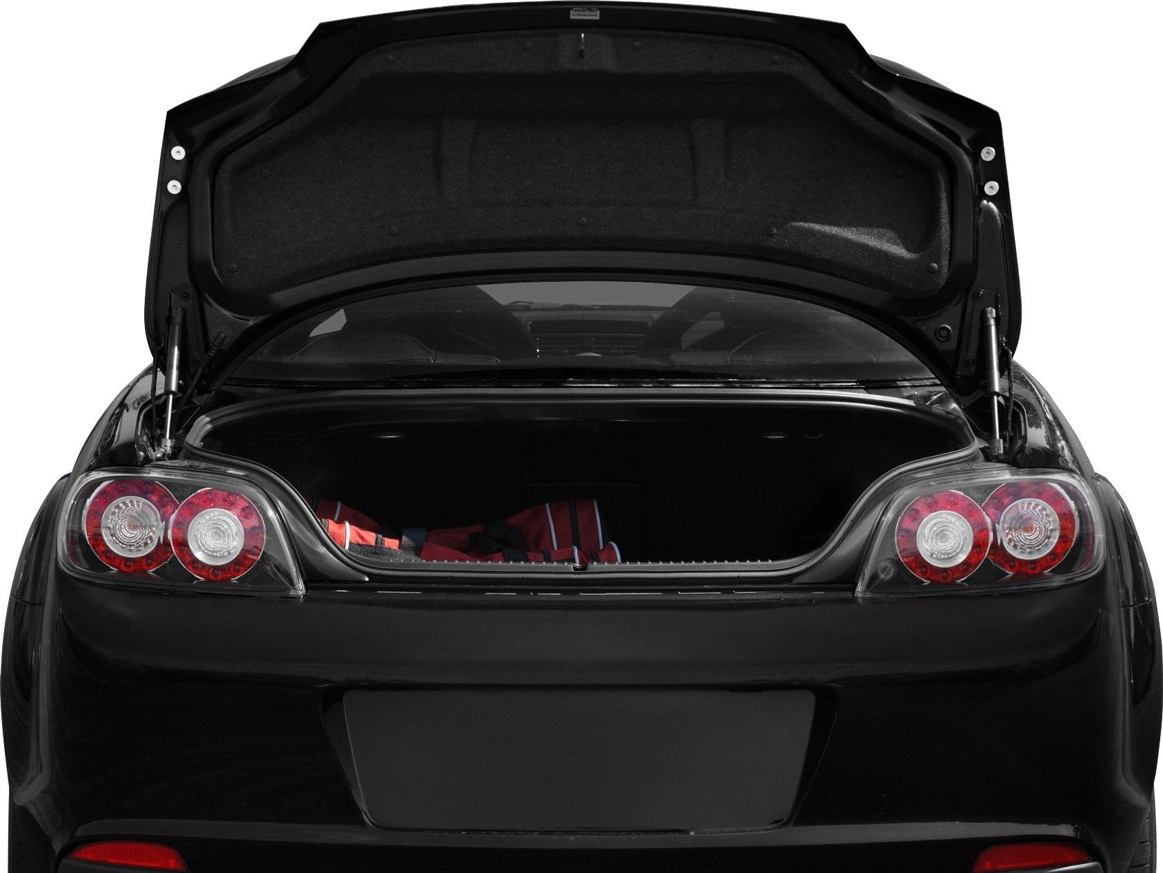 Rear view of a black car with an open trunk and round tail lights