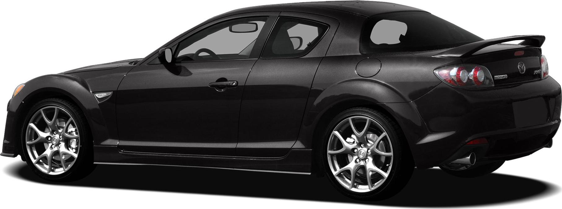 Rear-side view of a sporty coupe with alloy wheels and rear spoiler