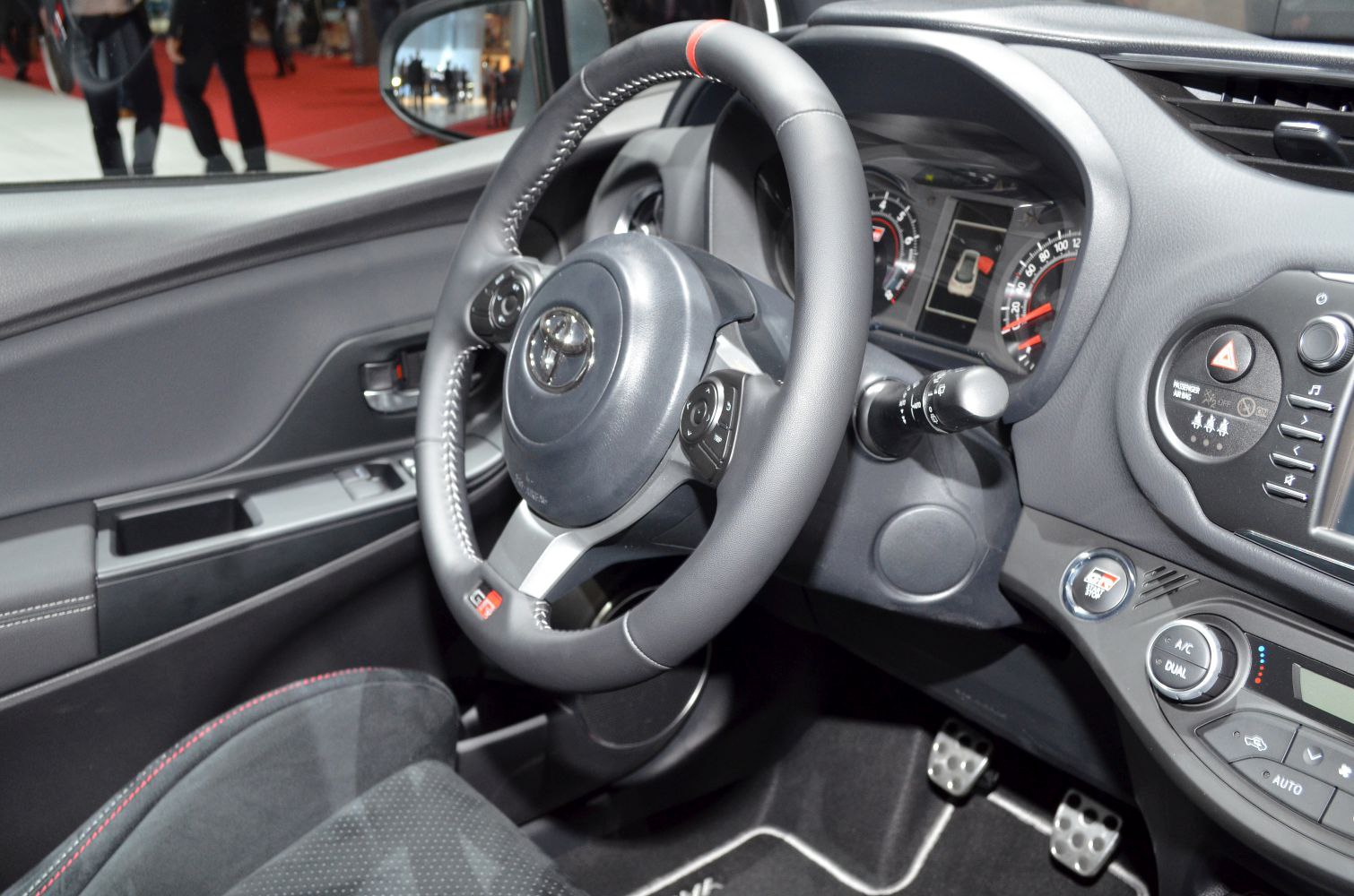 Sporty steering wheel and detailed dashboard with controls