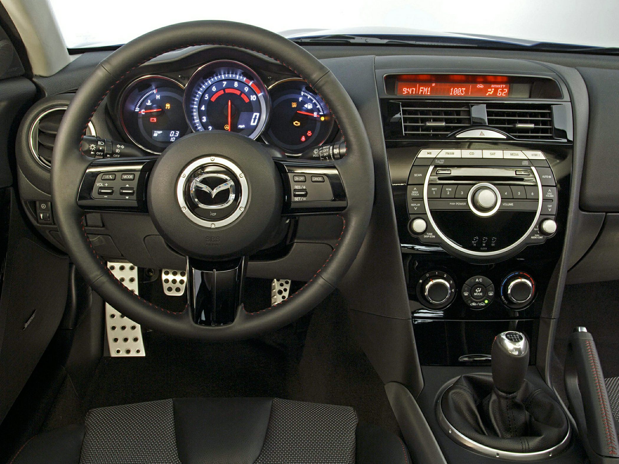 Steering wheel, instrument cluster, and manual transmission gear shift