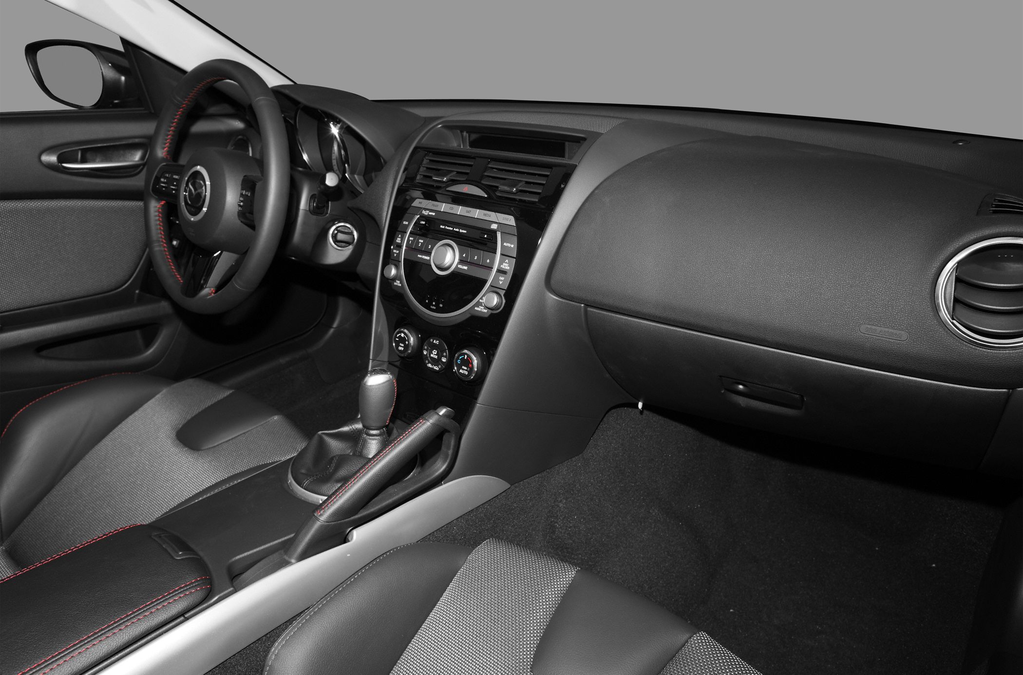 Dashboard and steering wheel with manual gear shift and air vents