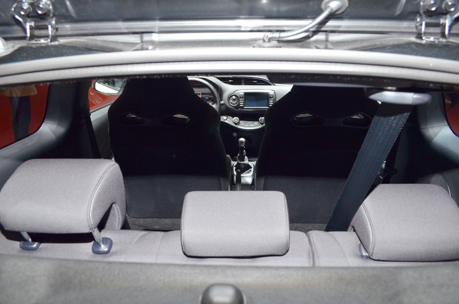 Interior view of seats, dashboard, and steering wheel