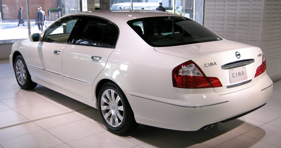 Rear and side profile of a luxury sedan with smooth lines and alloy wheels