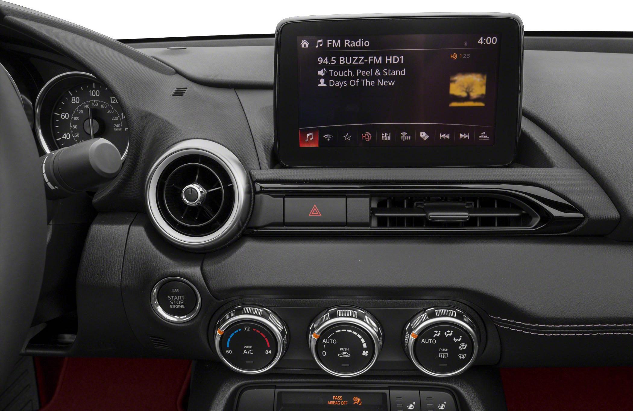 Interior dashboard with climate control knobs and infotainment display