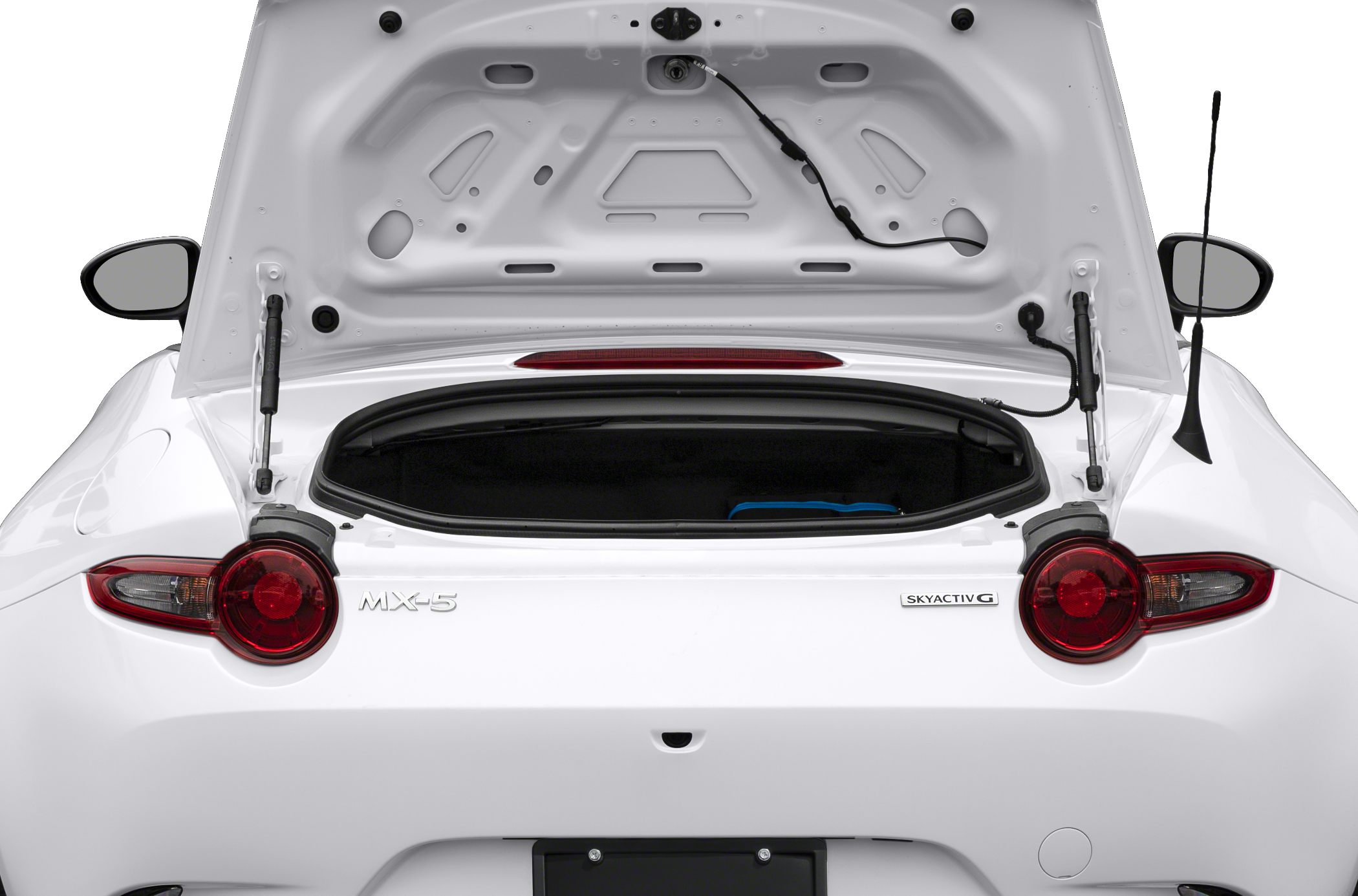 Open trunk and rear taillights with Skyactiv G badge on a white sports car rear.