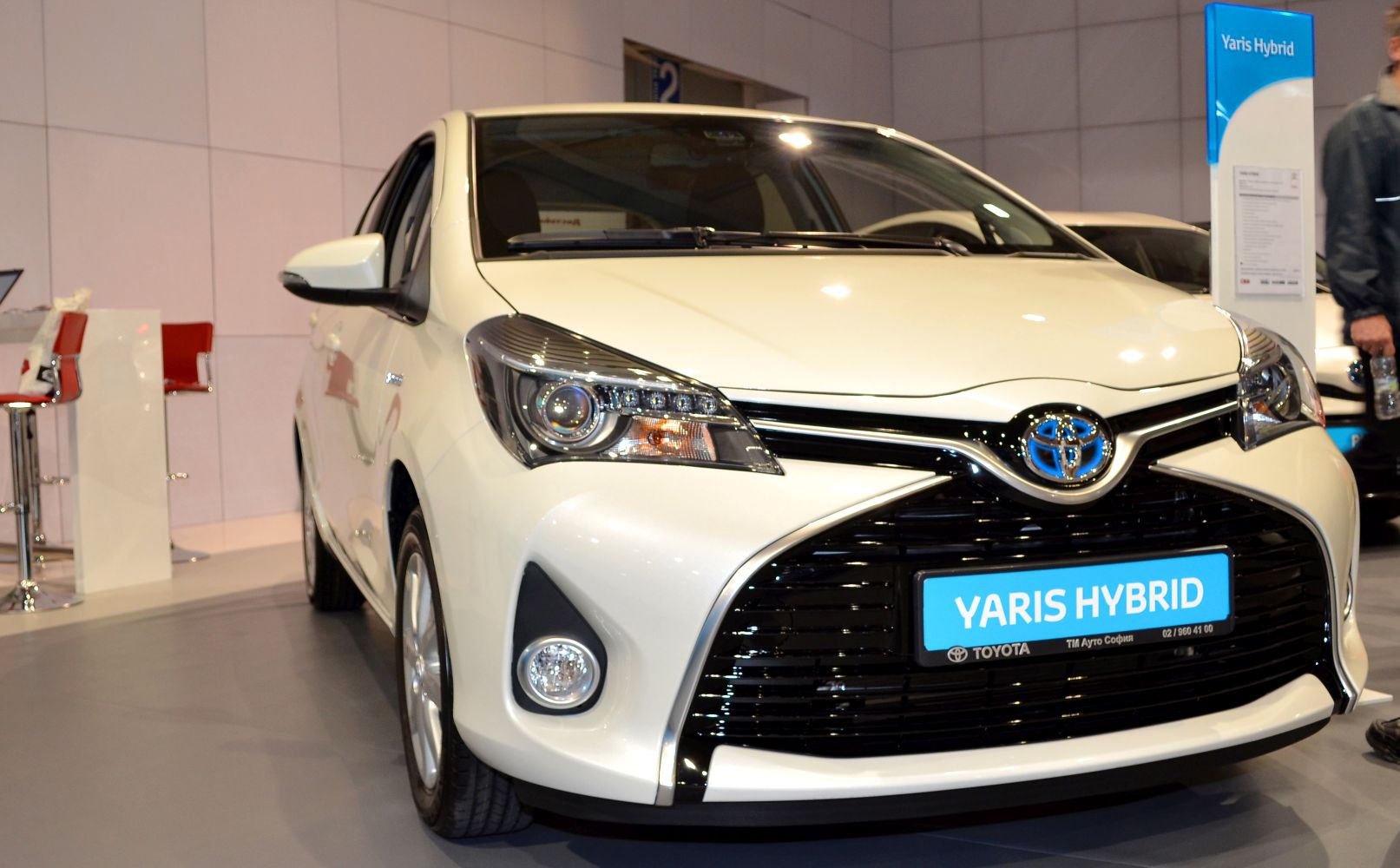 Front view with sleek headlights and distinctive grille