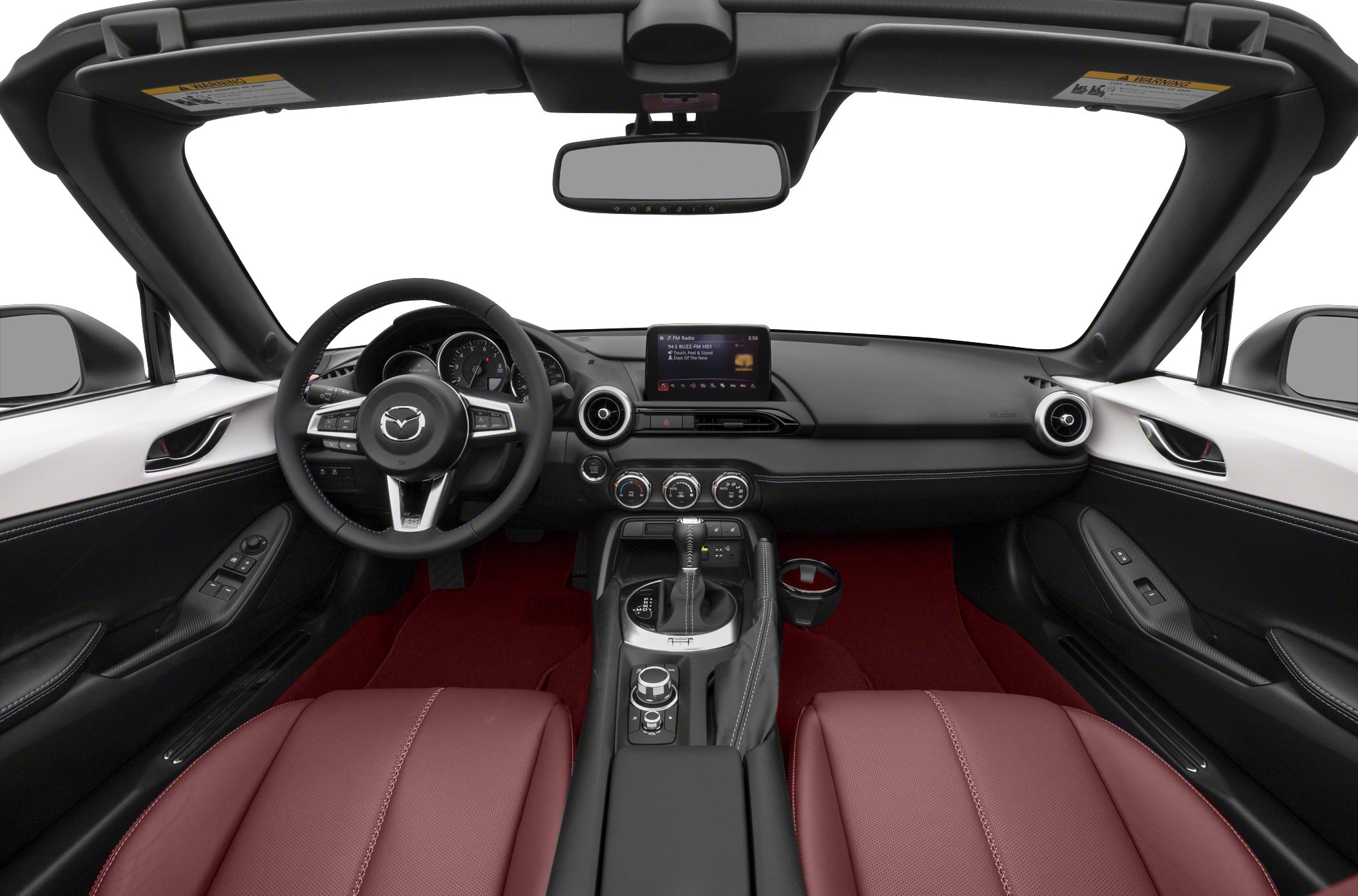 Red leather seats, dashboard with infotainment and manual gearshift