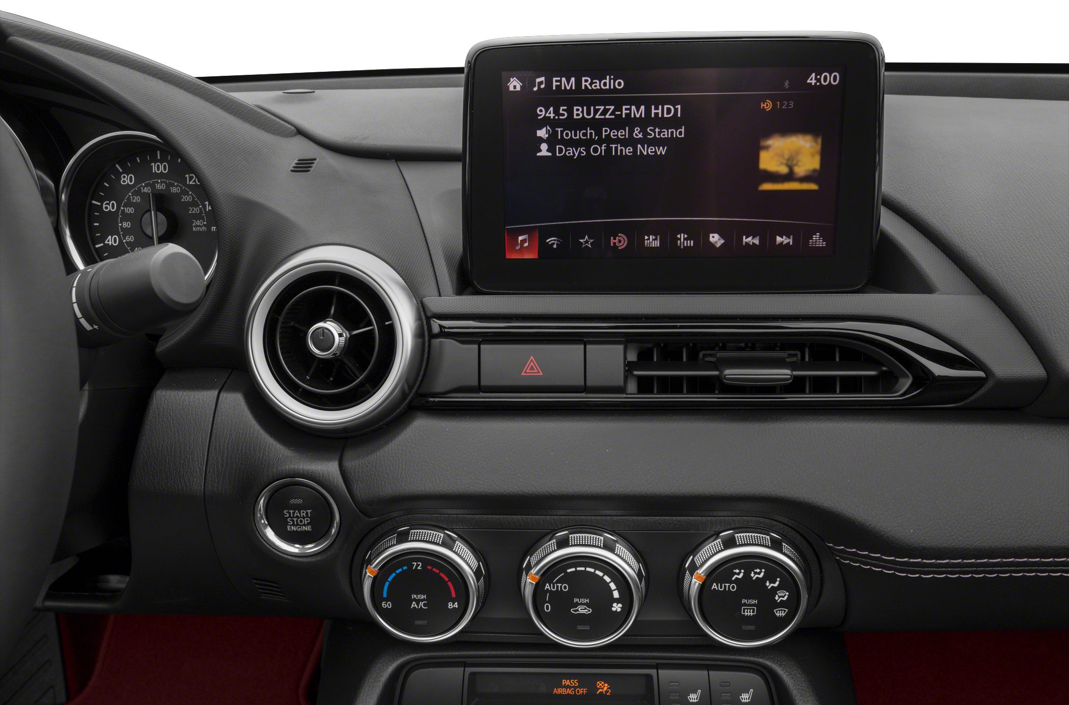Digital infotainment screen and manual climate control dials on dashboard