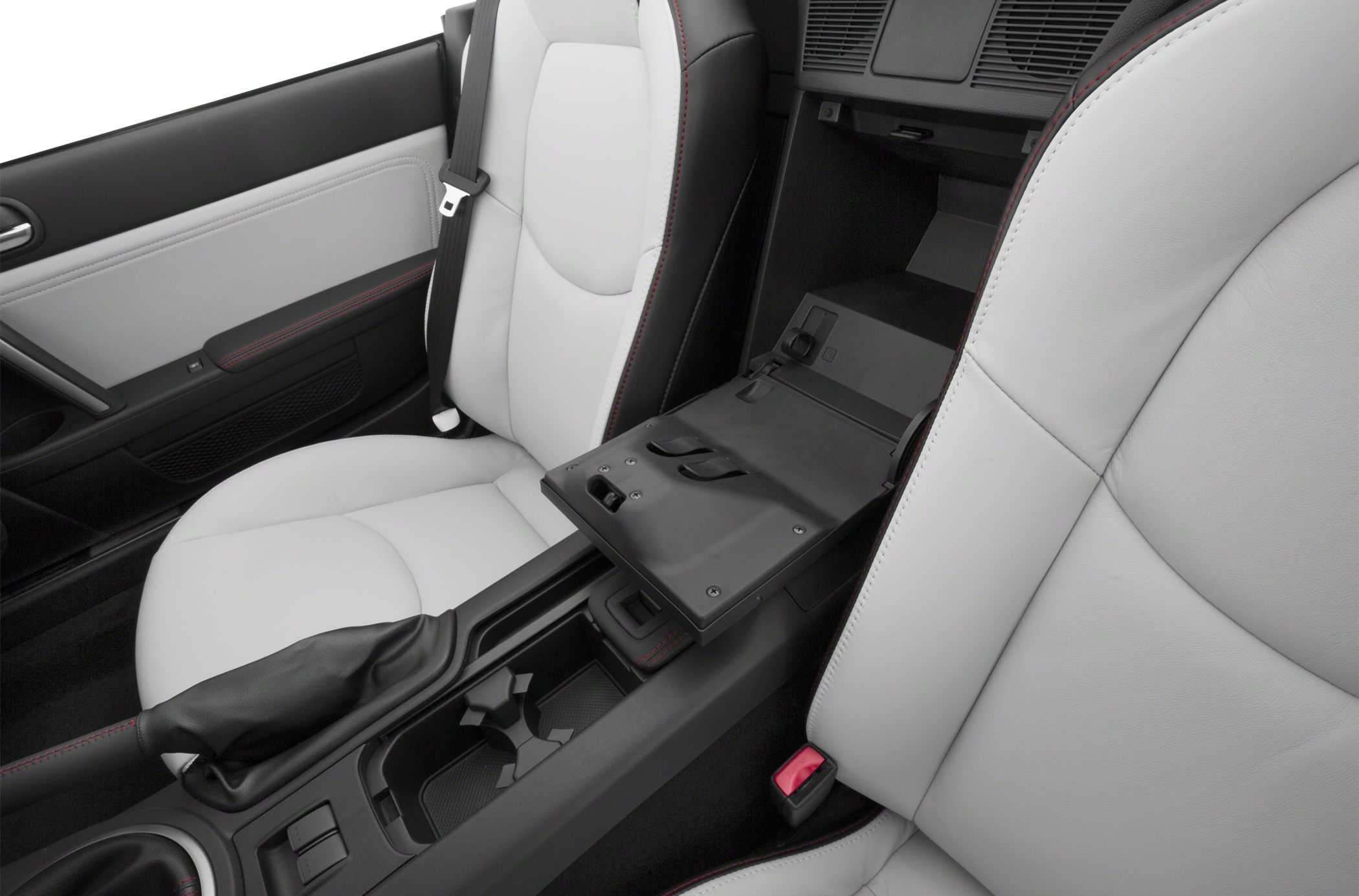 Center console storage and white leather seats with red stitching