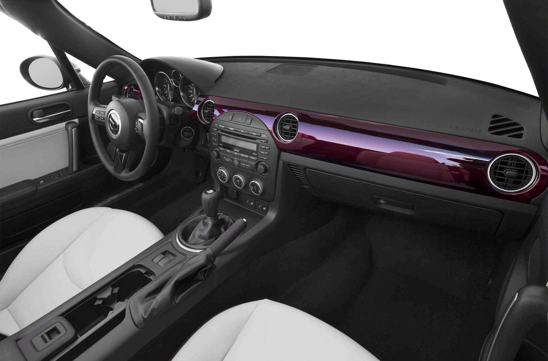 Dashboard, manual gear stick, air vents, two-tone seats interior