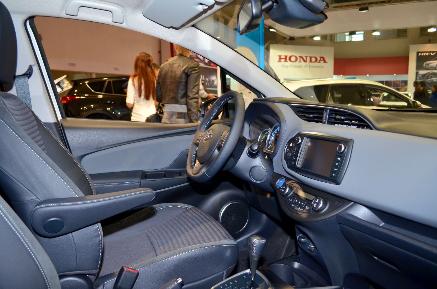 Front interior with detailed dashboard, steering wheel, and driver's seat.