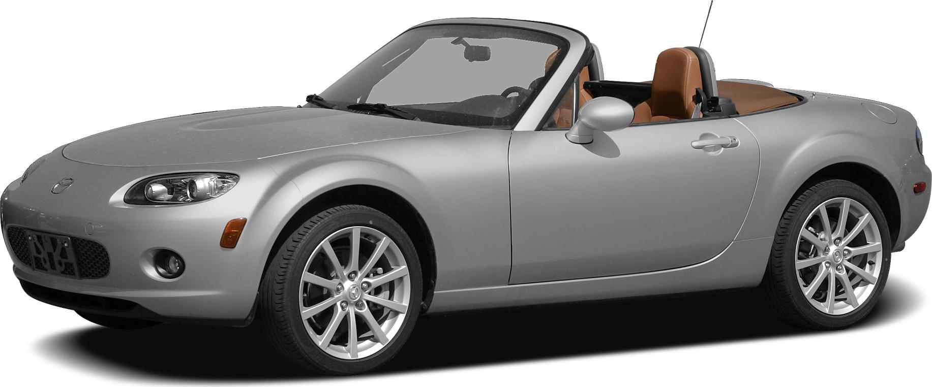 Convertible roadster with silver paint and alloy wheels.