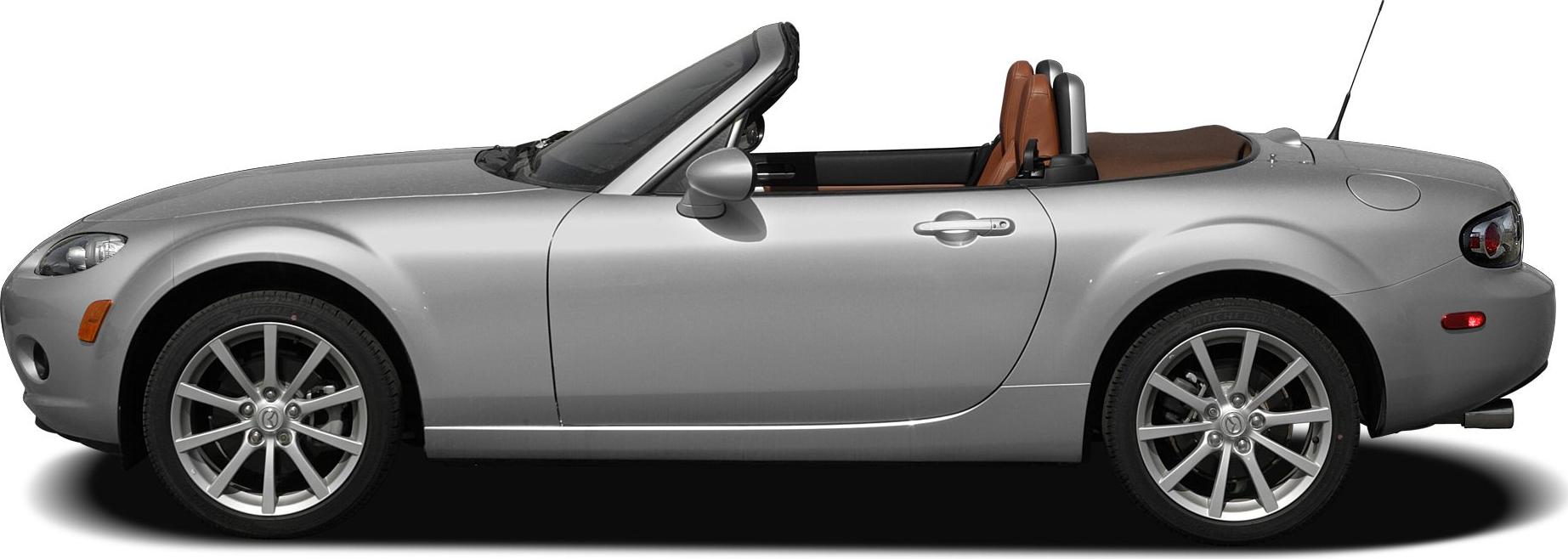 Side profile of convertible roadster with alloy wheels and open top