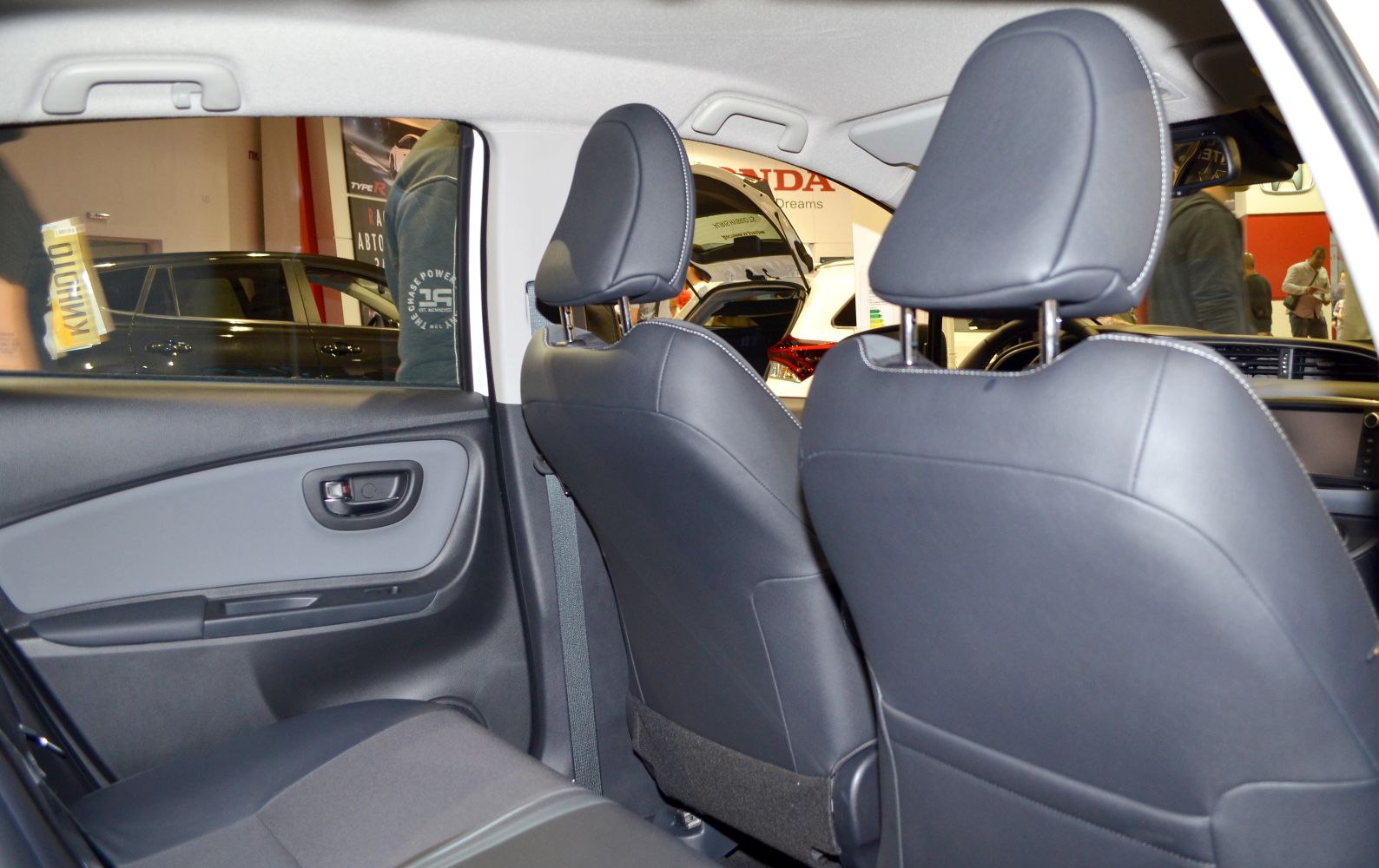 Rear seat interior and door panel with upholstery and headrests