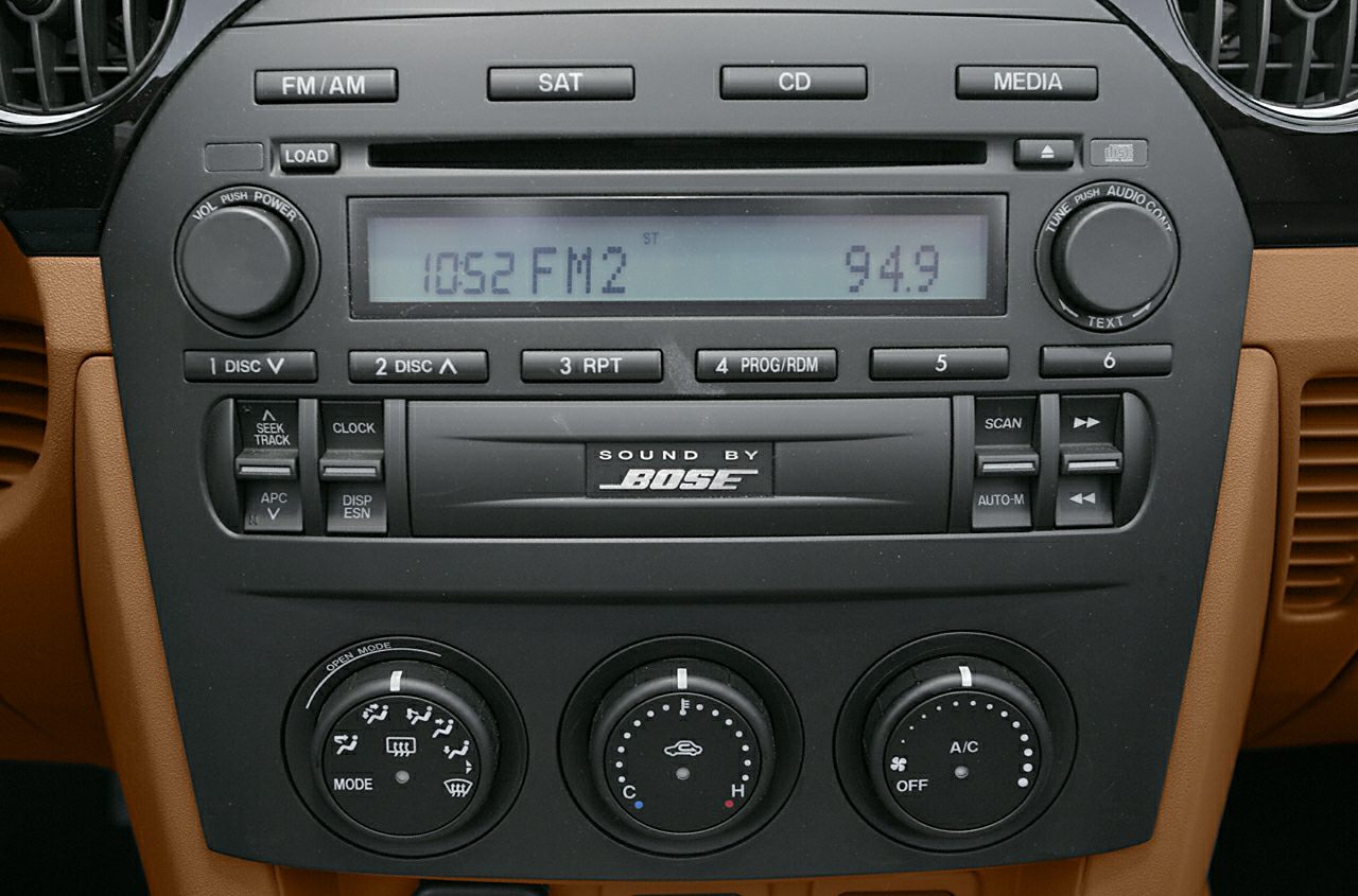 Car stereo system with Bose audio and climate control knobs
