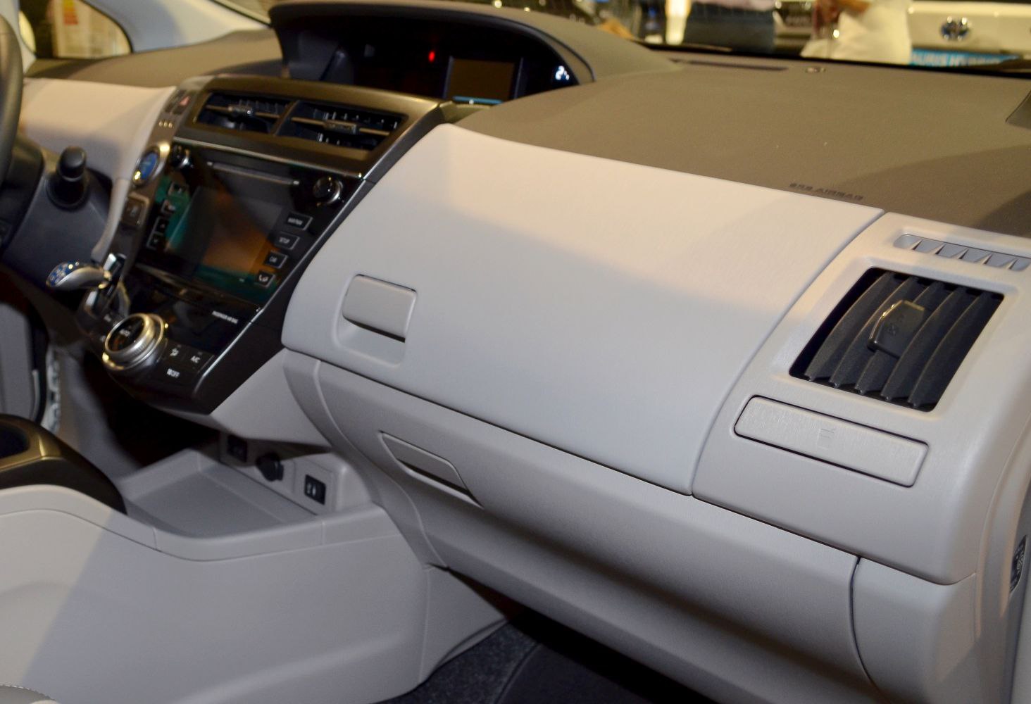 Dashboard and center console with air vents and controls.