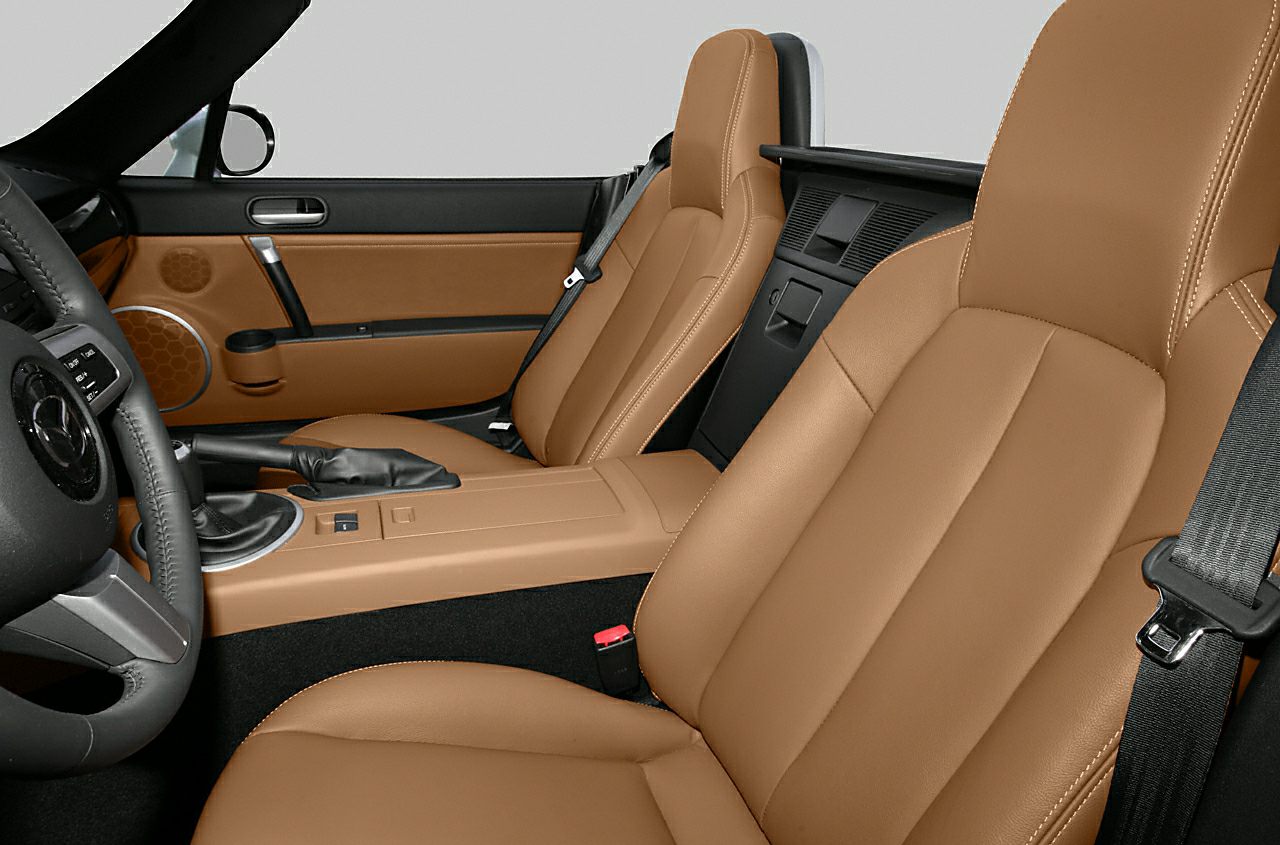 Brown leather seats and manual transmission cabin interior