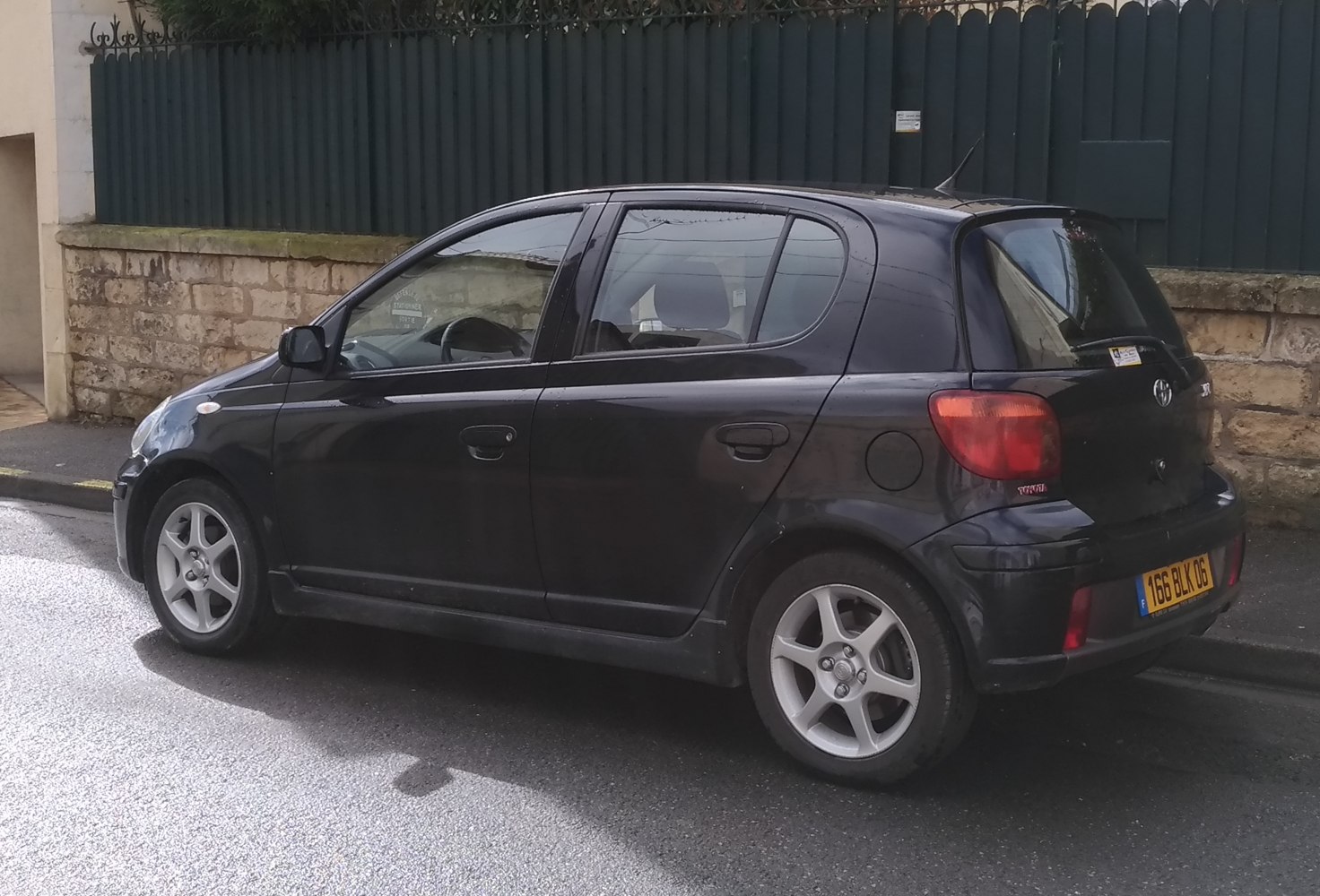 Black 5-door hatchback side profile with alloy wheels