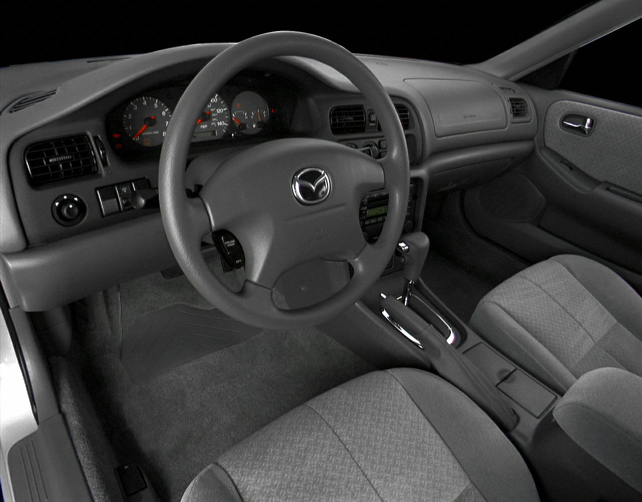 Dashboard, steering wheel, and gear shifter interior layout