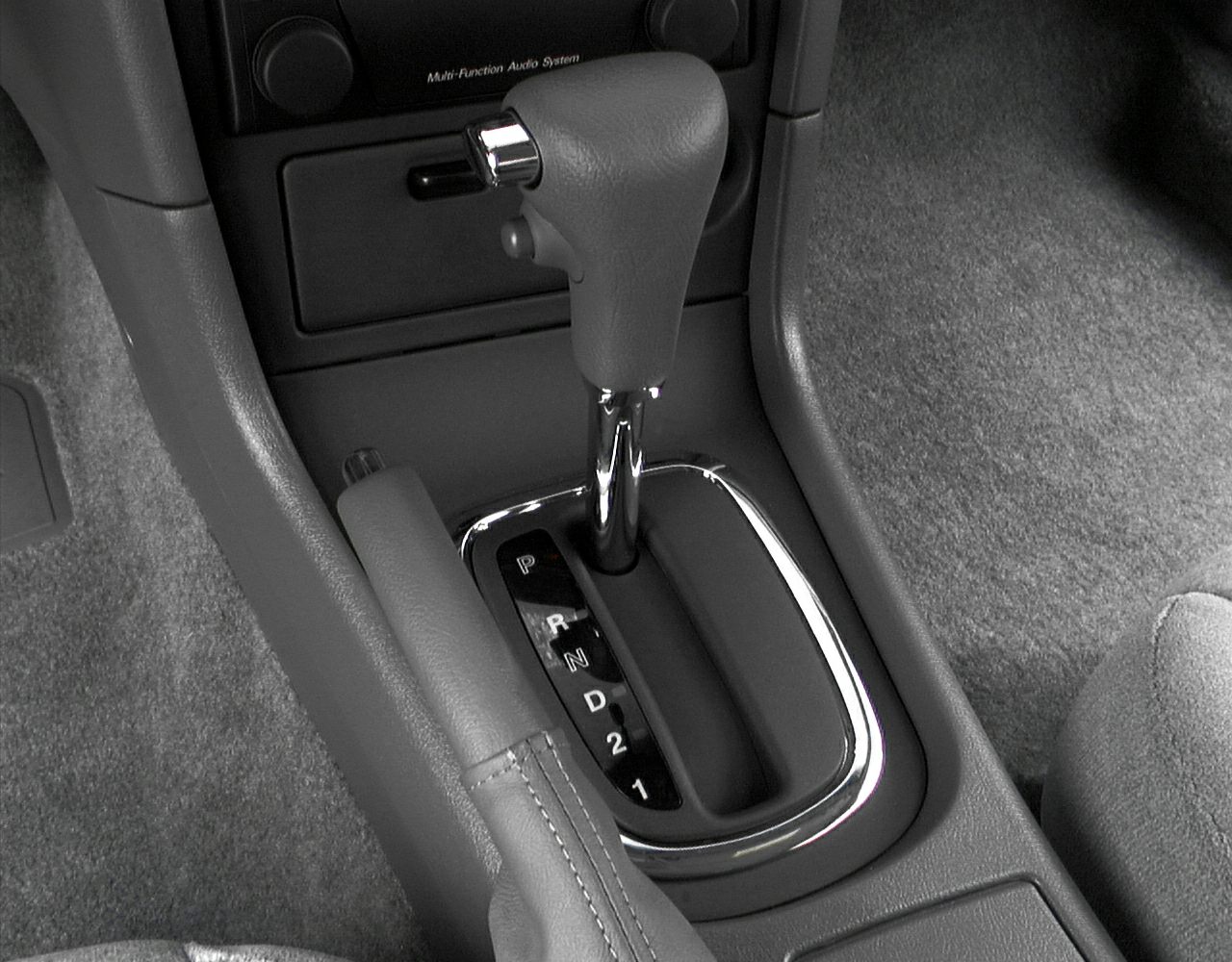 Automatic gear shift and handbrake in car interior