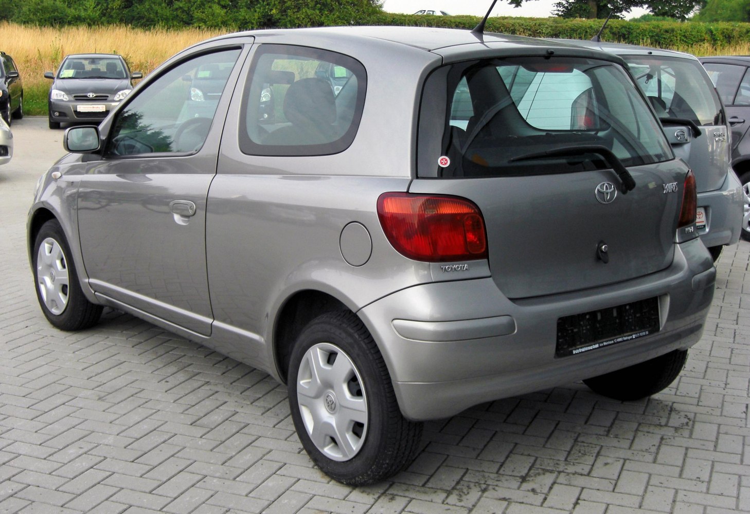 Compact 3-door hatchback rear with taillights and rear windshield wiper