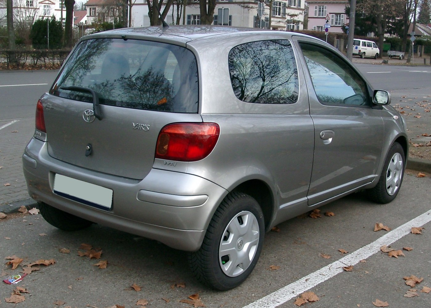 Rear and side view of 3-door compact hatchback with silver finish.