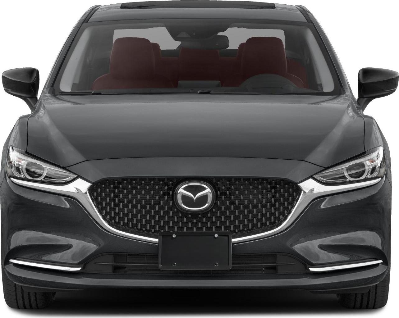 Front view with prominent grille and sharp headlights of a sedan