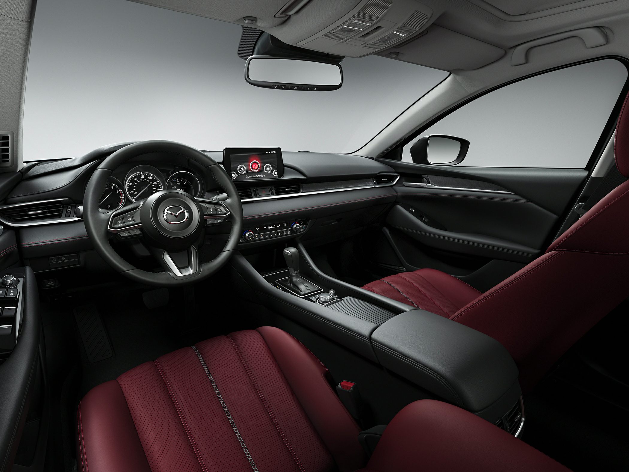 Luxurious interior with red leather seats and modern infotainment system