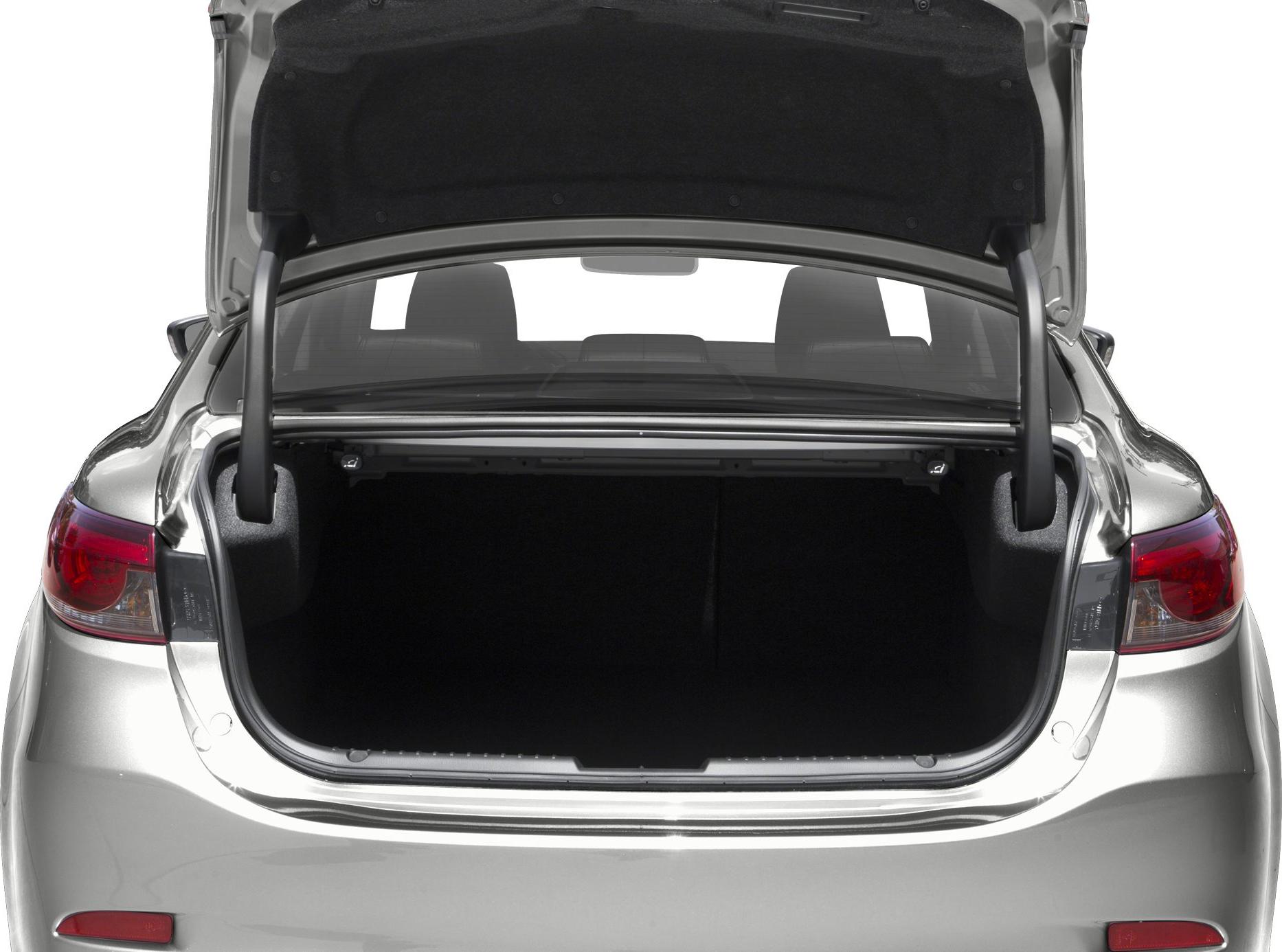 Open rear trunk space of a sedan with visible trunk details and rear seats.