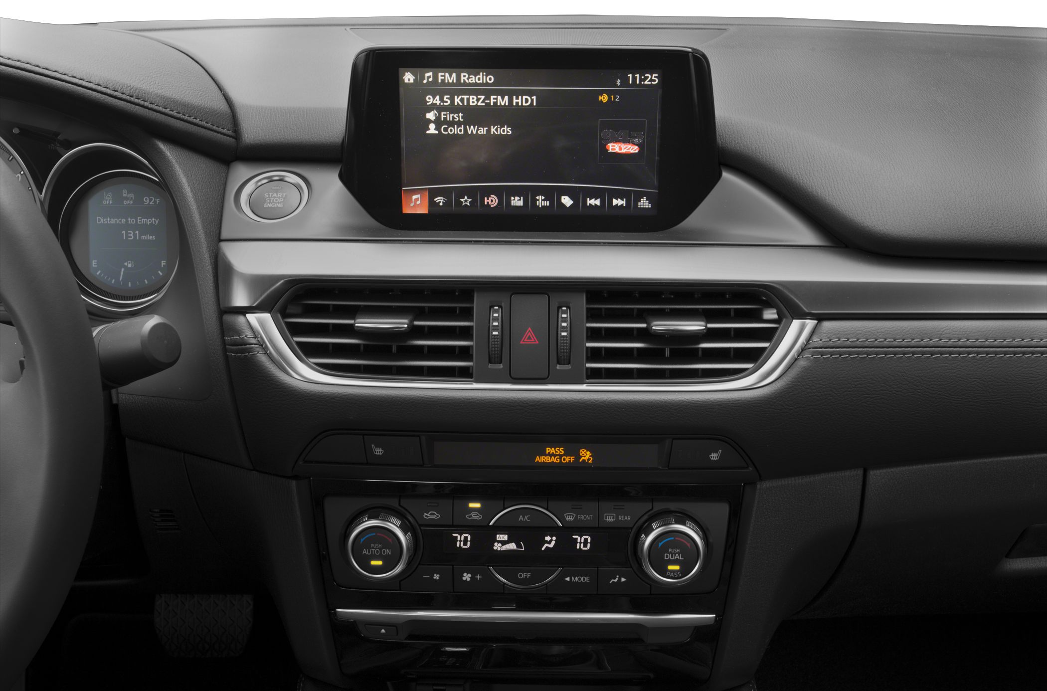 Center console with infotainment screen and dual zone climate control.
