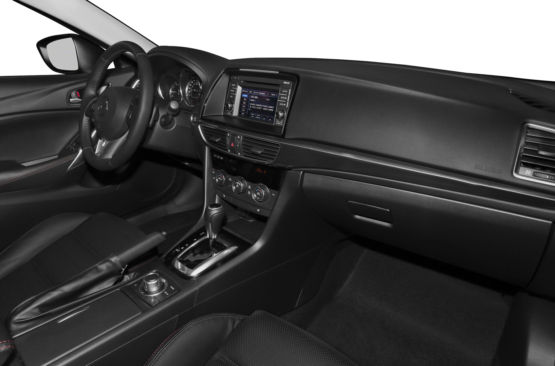 Car interior with dashboard, infotainment screen, steering wheel, and center console