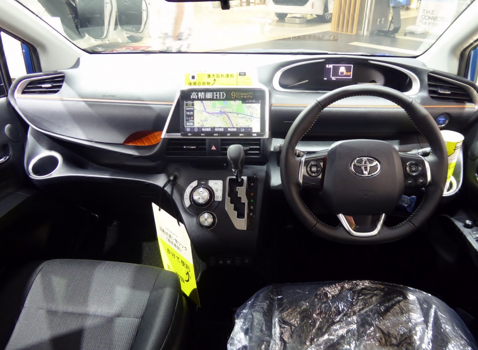 Dashboard with touchscreen navigation and steering wheel controls