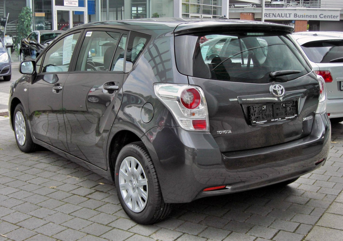 Compact hatchback rear view with distinctive tail lights