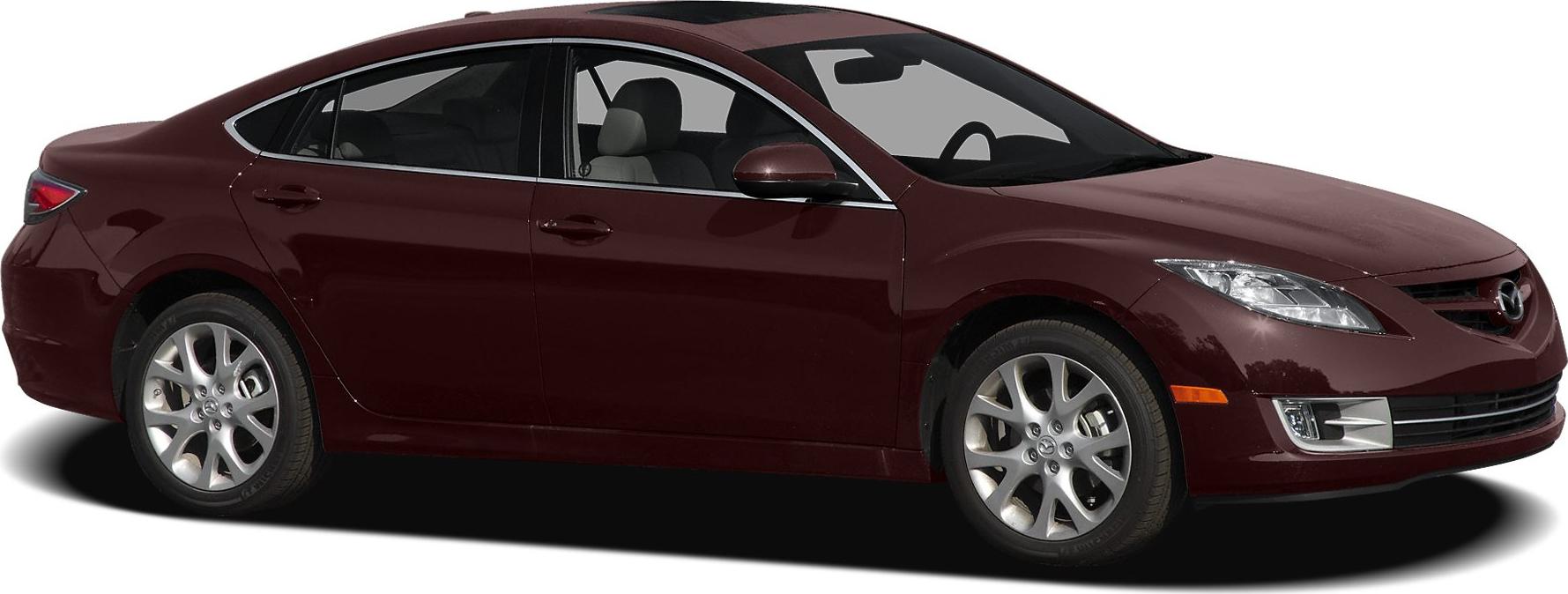 Side profile and alloy wheels of a mid-size sedan in dark red