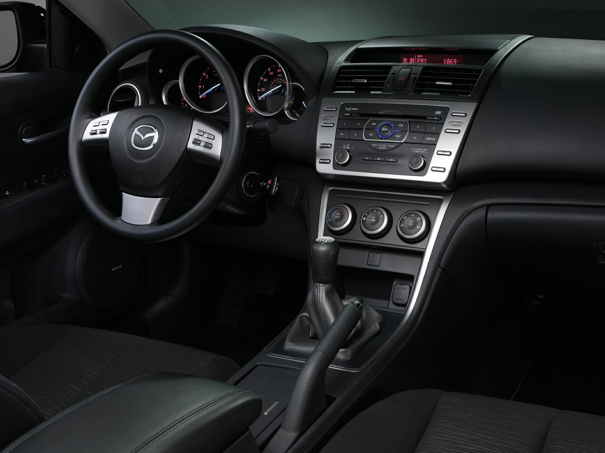 Interior dashboard, steering wheel, manual gear shift