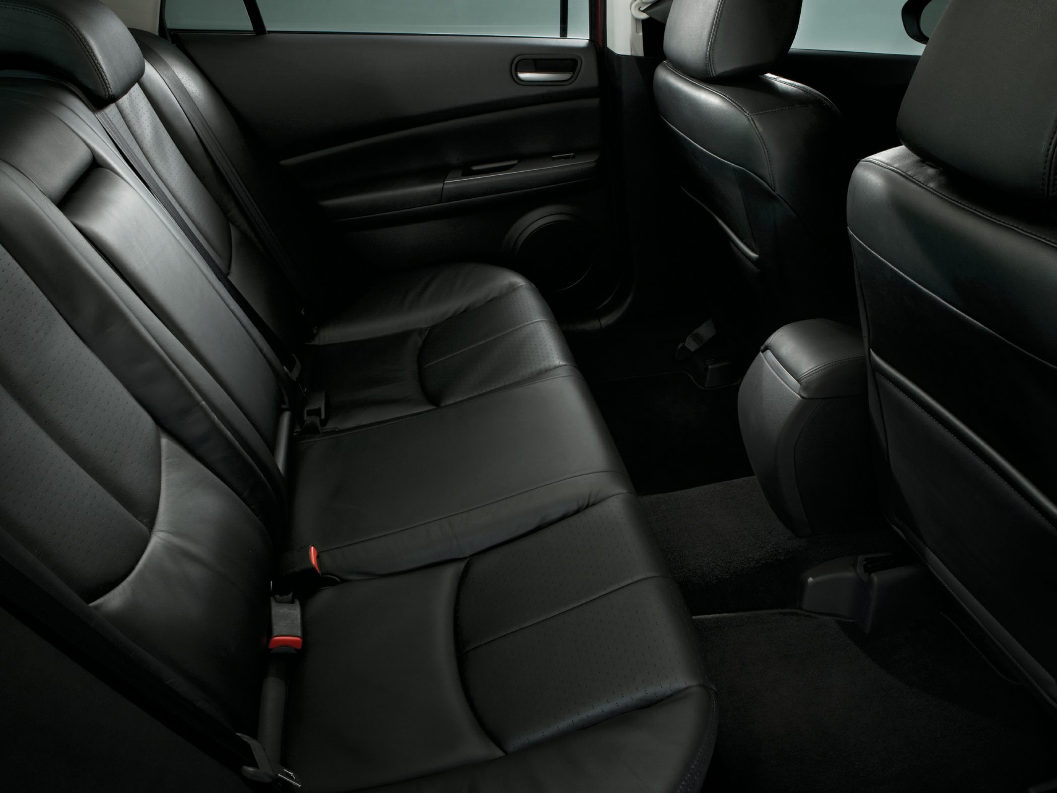 Black leather rear seats with seat belts and spacious legroom