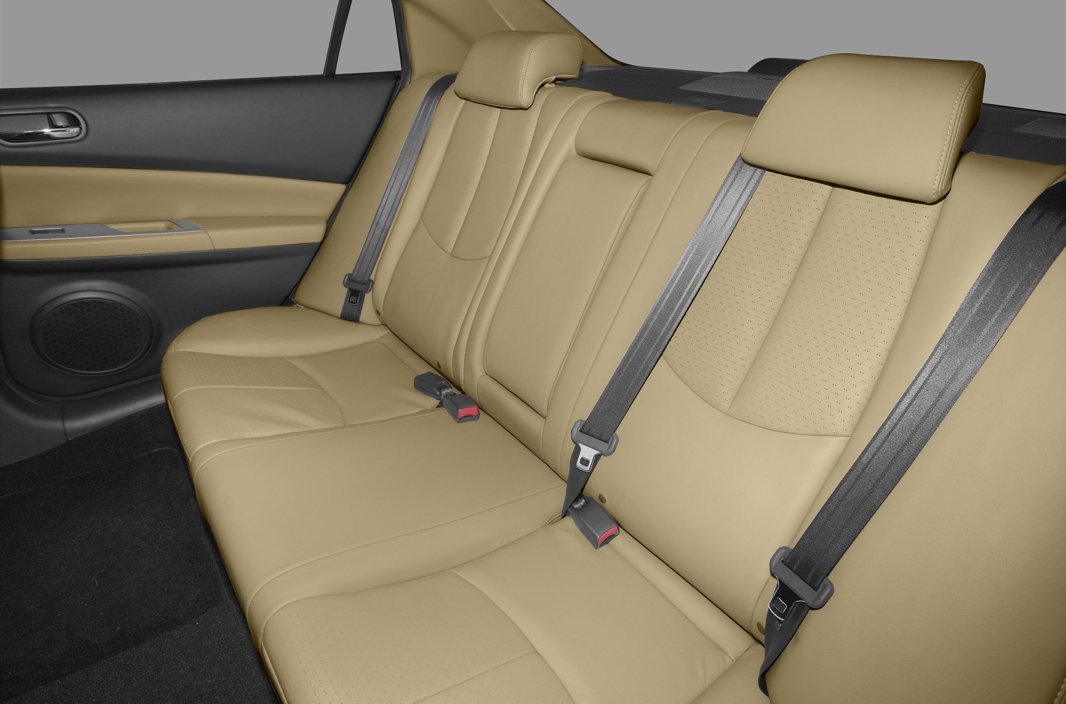 Beige leather rear seats with integrated headrests and seatbelts