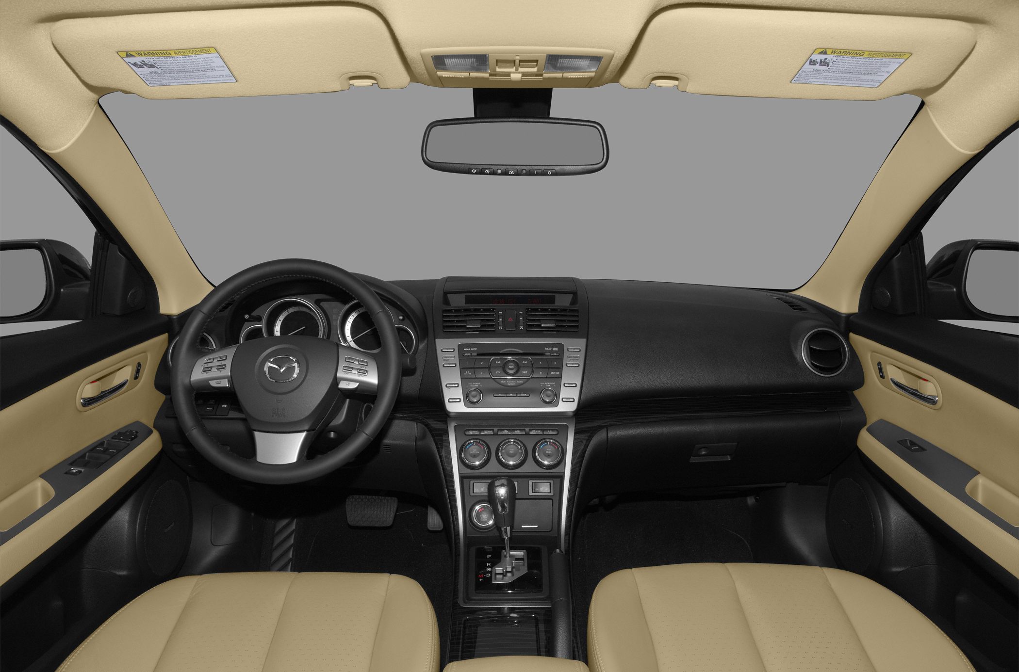 Dashboard and steering wheel with controls, beige seats
