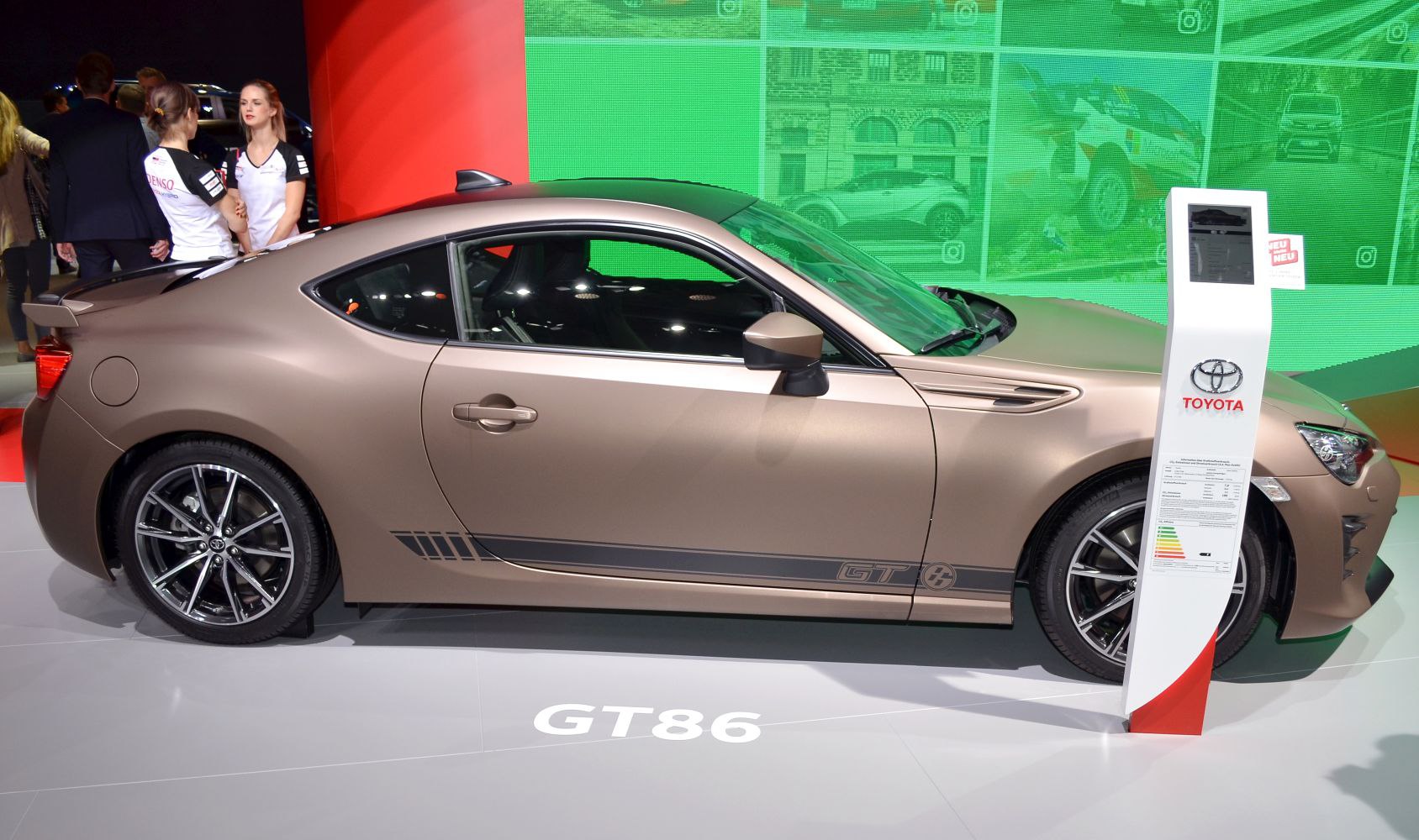 Side profile of a sleek sports coupe with GT decal and facelift design features