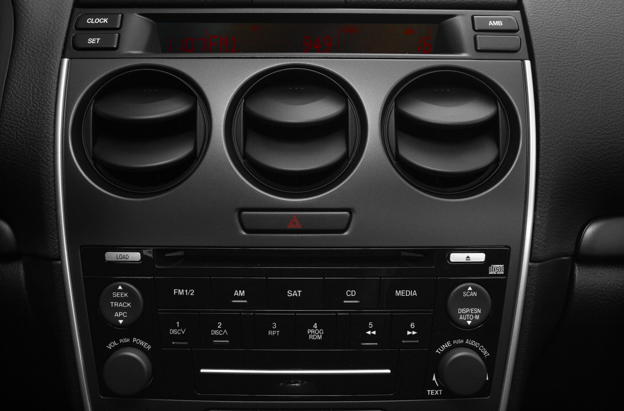 Dashboard air vents and audio controls layout in black finish